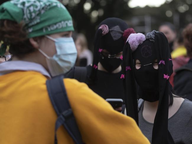 SYDNEY, AUSTRALIA - JUNE 02: A protestor uses as paid of tights as a mask in Hyde Park during a Black Lives Matter" rally, held in solidarity with U.S. Protests over the death of George Floyd on June 02, 2020 in Sydney, Australia. The event was organised to rally against aboriginal deaths in custody in Australia as well as in solidarity with protests across the United States following the killing of an unarmed black man George Floyd at the hands of a police officer in Minneapolis, Minnesota. (Photo by Brook Mitchell/Getty Images)