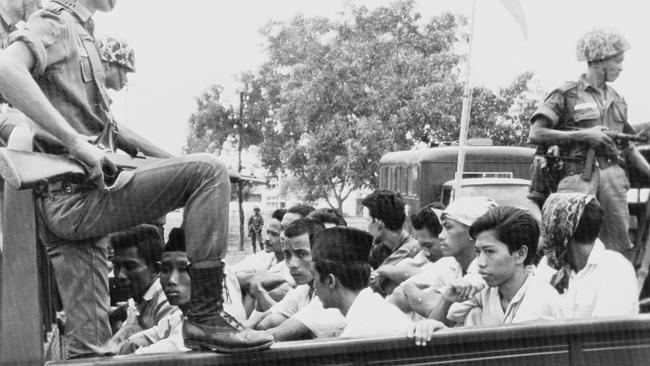 Members of the Youth Wing of the Indonesian Communist Party are truck to prison in Jakarta in October 1965.