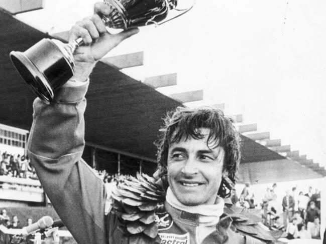 Peter Brock celebrates after winning the 1979 Bathurst 1000 in a Holden Torana.