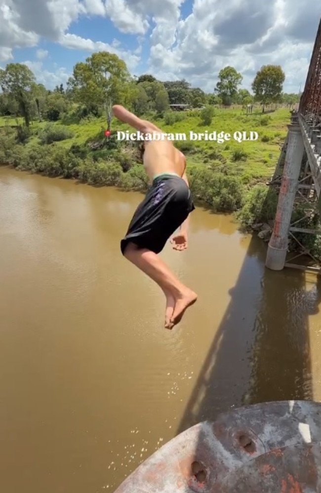 A still from the video of young men doing multiple somersaults from the top of the arch of Miva’sDickabram Bridge, which stands about 30m above the water and has had almost 100,000 views and plenty of criticism. The video was posted to the Facebook page Sentdownunder.