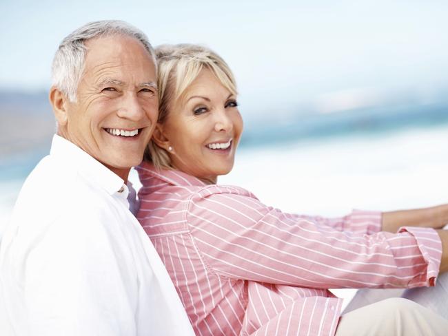 Happy retiree couple enjoying their seachange. Istock photo free to use.