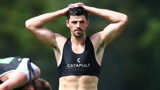 Scott Pendlebury works up a sweat at pre-season training.