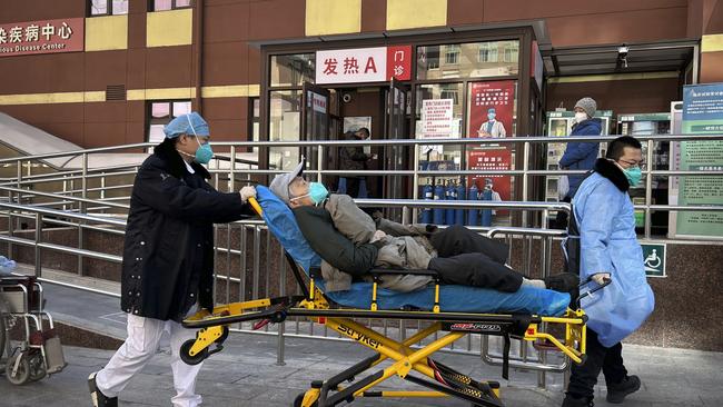 A patient is wheeled on a gurney into a busy infectious diseases clinic at a hospital on January 2 in Beijing, China. Picture: Getty Images