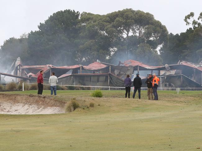 Club members and police assess the damage. Picture: David Crosling