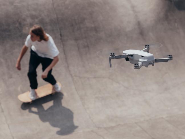 DJI's latest drone, the Mavic Mini, weighs only 249 grams and can capture photos and videos from the sky, using a smartphone and accessory to control it.