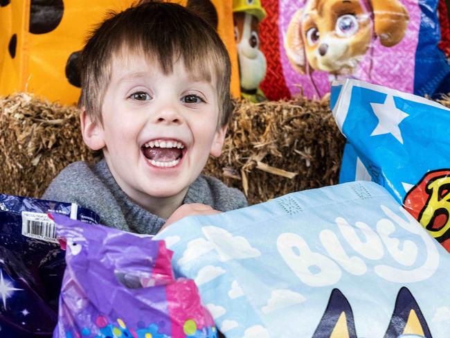 ADELAIDE, AUSTRALIA - NewsWire Photos 11th August, 2023:  Alfie (4) getting excited with show bags at the Adelaide Royal Show. Picture: NCA NewsWire / Kelly Barnes