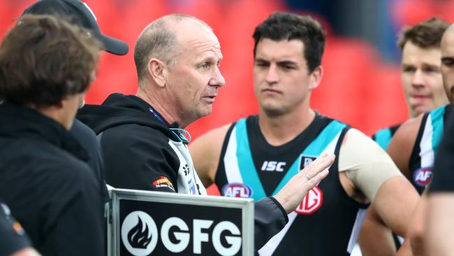 Tom Rockliff listens to Ken Hinkley during Port’s win over West Coast on the weekend. Picture: Jono Searle/Getty