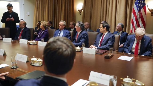 Elon Musk addresses the cabinet. The President appears to be looking at his phone under the table – not nodding off – though either way he’s hardly riveted. Picture: Pool via AP