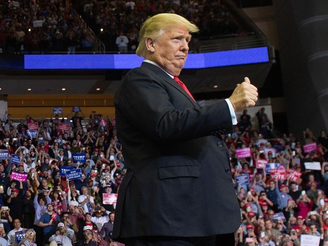 TOPSHOT - US President Donald Trump arrives for a campaign rally at the Toyota Center in Houston, Texas, on October 22, 2018. (Photo by SAUL LOEB / AFP)