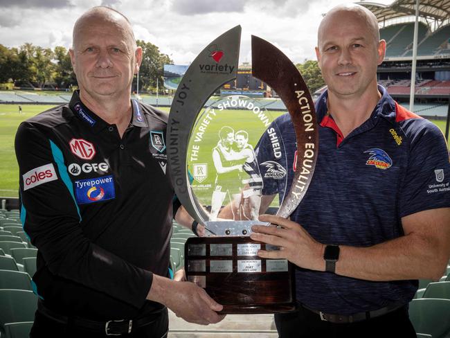 ADELAIDE, AUSTRALIA - Advertiser Photos MARCH 31, 2023: AFL Port Adelaide Football Club Coach Ken Hinkley and Adelaide Football Club Coach Matthew Nicks hold the Showdown Trophy ahead of Showdown 53 at Adelaide Oval, SA. Picture: Emma Brasier