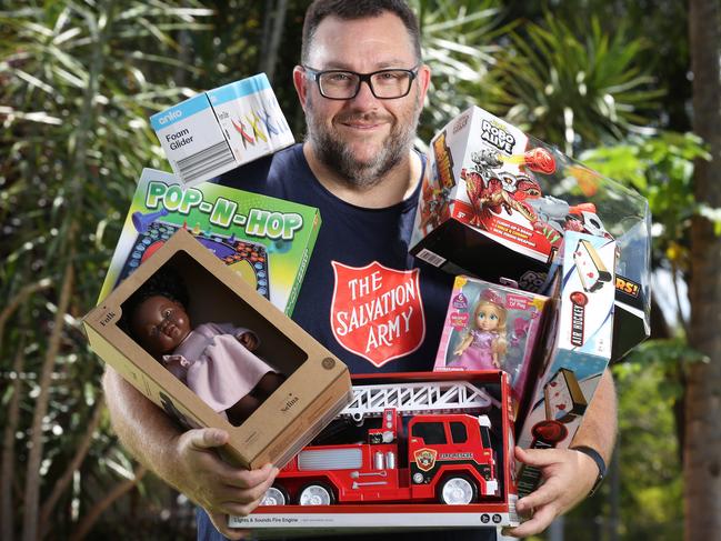 The Salvos’ Simon Gregory with just an armful of the tens of thousands of toys donated to their Christmas appeal. Picture: Liam Kidston