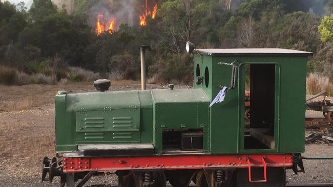 JOINING FORCES: Tullah locals save Wee Georgie Wood Steam Railway train from a fiery fate. Picture: Supplied