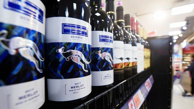 (FILES) This file photo taken on November 27, 2020 shows bottles of Australian wine at a supermarket in Hangzhou, in eastern China's Zhejiang province. - China on December 10, 2020 said it had imposed fresh import duties on Australian wine as it accused Canberra of giving firms subsidies, in the latest salvo in a bitter stand-off following last month's swingeing anti-dumping tariffs. (Photo by STR / AFP) / China OUT