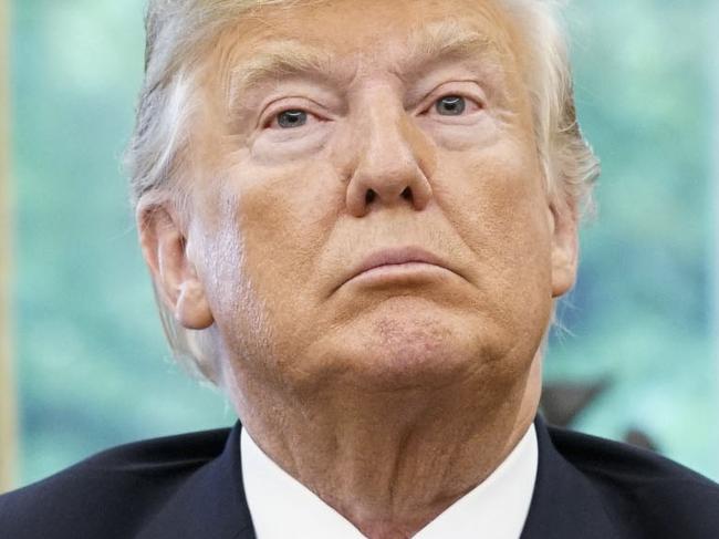 (FILES) In this file photo taken on August 27, 2018, US President Donald Trump listens during a phone conversation with Mexico's President Enrique Pena Nieto on trade in the Oval Office of the White House in Washington, DC. - Trump on September 1, 2018, threatened to exclude Canada from a new NAFTA agreement after negotiations to rewrite the pact ended without an agreement on August 31. "There is no political necessity to keep Canada in the new NAFTA deal. If we don't make a fair deal for the US after decades of abuse, Canada will be out," he tweeted. (Photo by MANDEL NGAN / AFP)