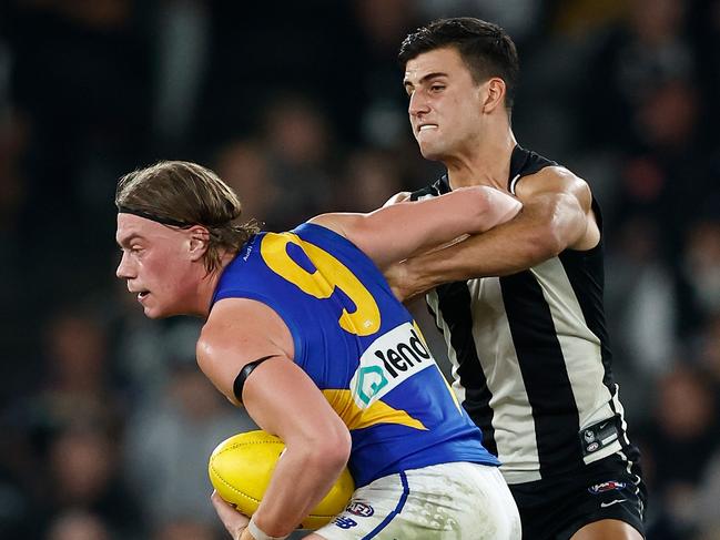 Harley Reid tries to get away from Nick Daicos. Picture: Michael Willson/AFL Photos via Getty Images