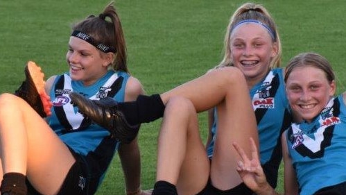 Port Adelaide under-16 girls players Alicia Gaffney, Chloe and Madison Schwarz after lining up against the Crows at Alberton Oval this month. Picture: Supplied