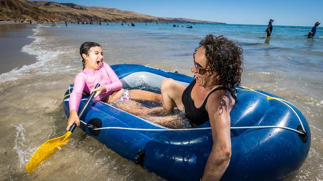 Maria Nascimento from Alice Springs with granddaughter Nylah Jong, 8, having fun at Sellicks Beach. Picture: Tom Huntley