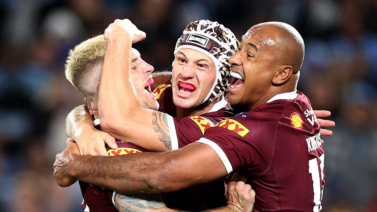 (L-R) Cameron Munster, Kalyn Ponga and Felise Kaufusi of the Maroons celebrate victory, as an Origin pay war looms (Photo by Mark Kolbe/Getty Images)