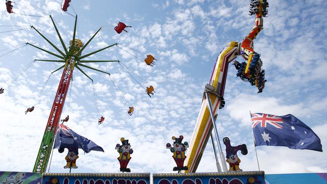 The skychair and March's Skywalker thrill rides in sideshow alley at the Cairns Show. PICTURE: BRENDAN RADKE