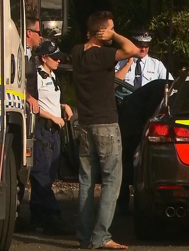A man believed to be a family member is seen in a distressed state at the Robertson Lookout carpark on Tuesday. Picture: TNV