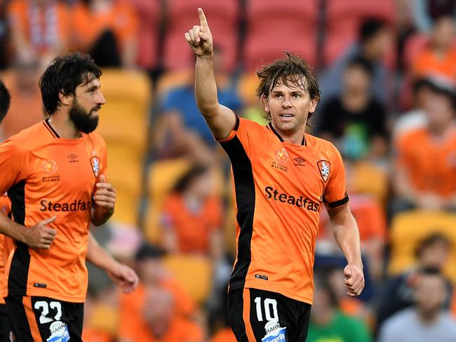 Brett Holman of the Brisbane Roar (right) celebrates scoring a goal during their round 27 A-League game against the Wellington Phoenix at Suncorp Stadium in Brisbane, Sunday, April 16, 2017. (AAP Image/Dan Peled) NO ARCHIVING, EDITORIAL USE ONLY