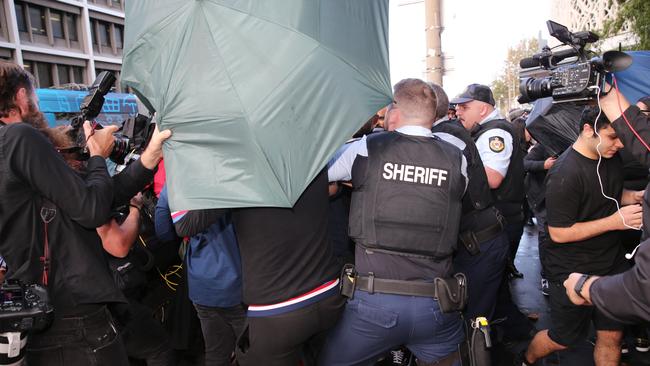 Jarryd Hayne supporters clash with the media outside the court in Newcastle, NSW, on Thursday. Picture: Peter Lorimer.