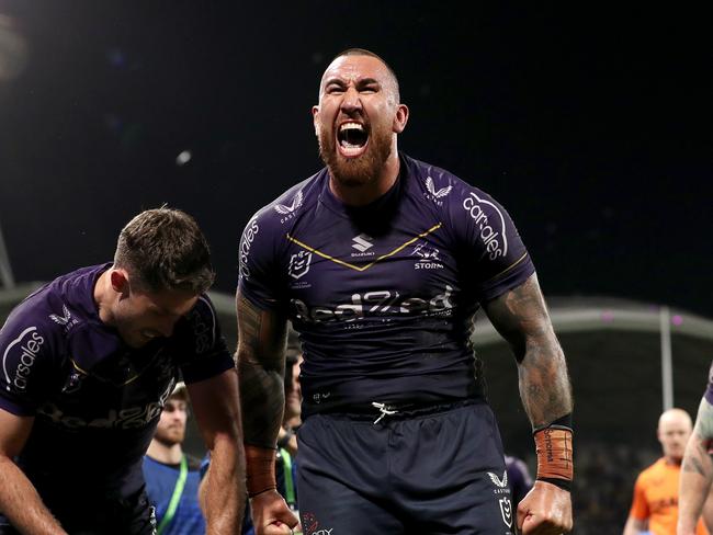 MELBOURNE, AUSTRALIA - SEPTEMBER 15: Nelson Asofa-Solomona of the Storm celebrates the try of Will Warbrick of the Storm during the NRL Semi Final match between Melbourne Storm and the Sydney Roosters at AAMI Park on September 15, 2023 in Melbourne, Australia. (Photo by Kelly Defina/Getty Images)