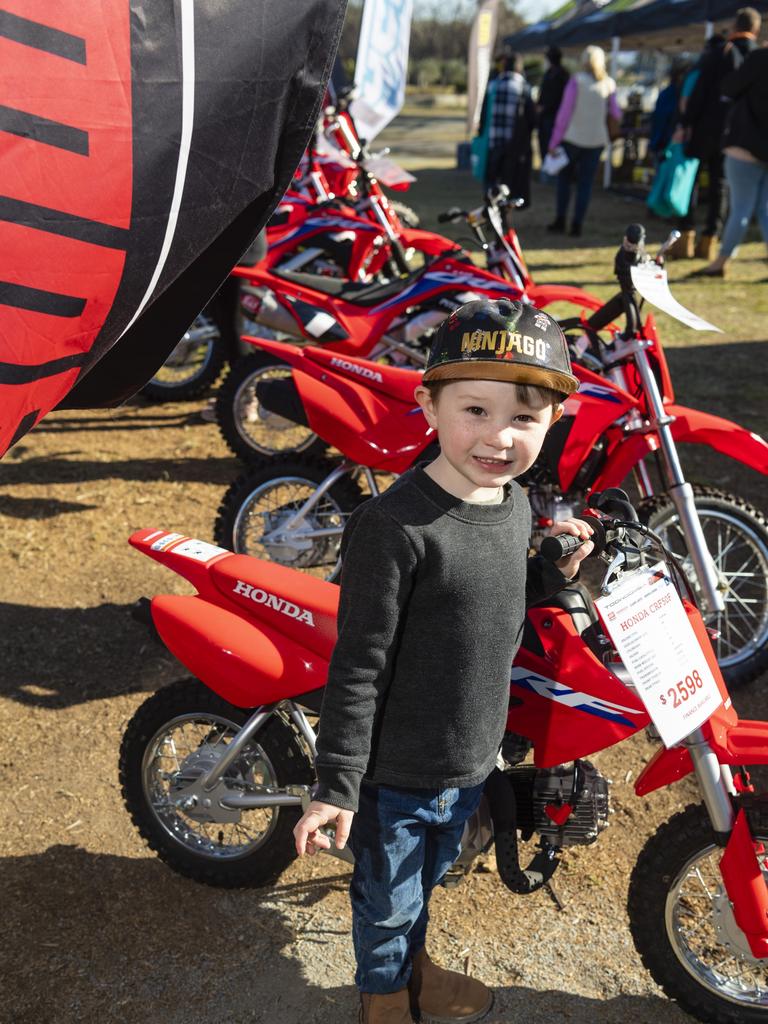 James Fulton with a Honda CRF50F at the Queensland Outdoor Adventure Expo at the Toowoomba Showgrounds, Saturday, July 30, 2022. Picture: Kevin Farmer