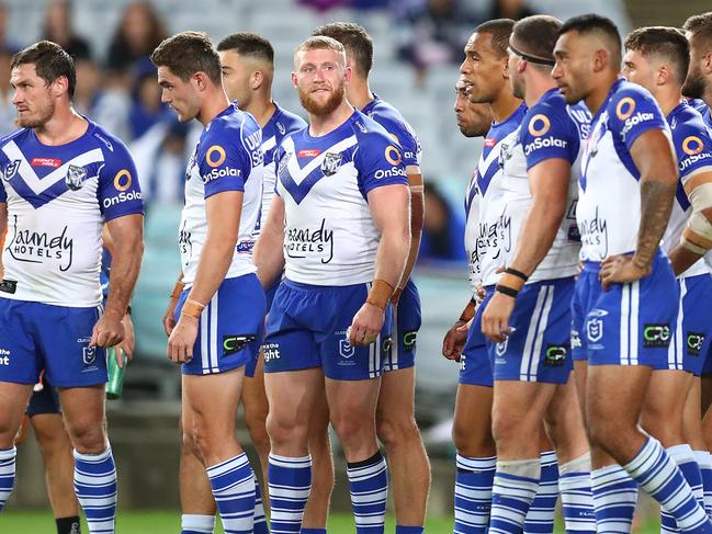 SYDNEY, AUSTRALIA - APRIL 10: Bulldogs players look dejected after conceding a try during the round five NRL match between the Canterbury Bulldogs and the Melbourne Storm at Stadium Australia, on April 10, 2021, in Sydney, Australia. (Photo by Mark Metcalfe/Getty Images)