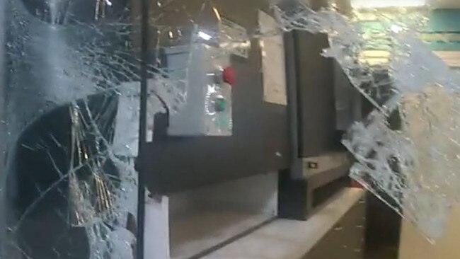 The footage shows smashed glass at the service station window. Photo: QPS