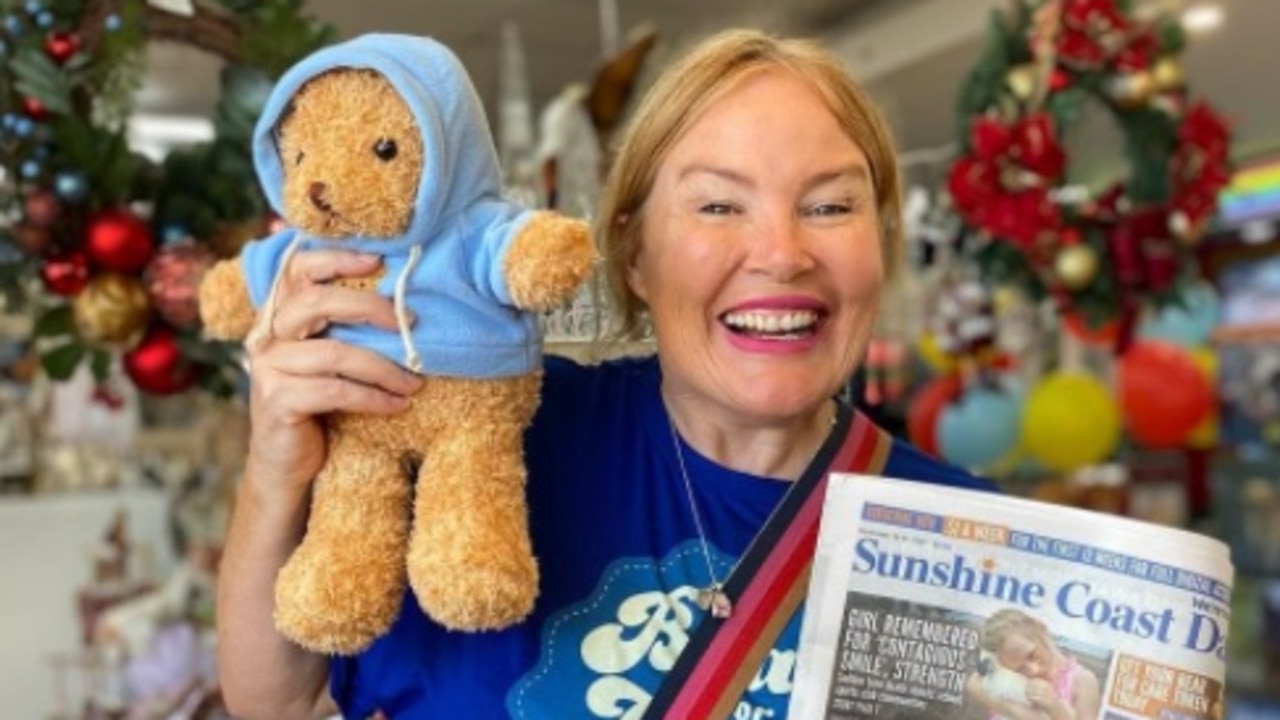 Caroline Hutchinson from 97.2 Mix FM grabs her Bear for Care teddy with her copy of the Sunshine Coast Daily. The Bear for Care campaign has now come to a close - thank you for your support.