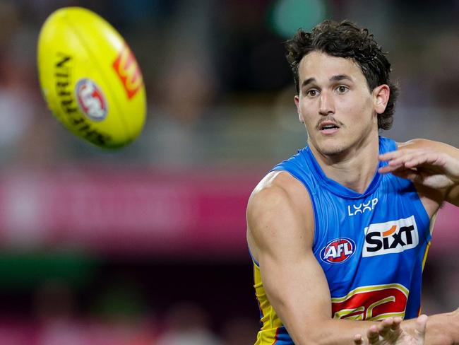 BRISBANE, AUSTRALIA - MAY 05: Wil Powell of the Suns and Charlie Cameron of the Lions in action during the 2024 AFL Round 08 match between the Brisbane Lions and the Gold Coast SUNS at The Gabba on May 05, 2024 in Brisbane, Australia. (Photo by Russell Freeman/AFL Photos via Getty Images)