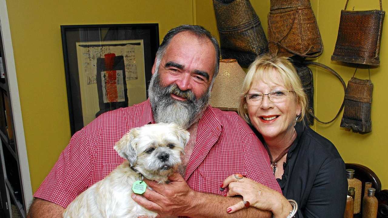 The late artist Sue Coburn and partner Bob Abbot with the family dog Toby at the couple&#39;s Boreen Point home. Picture: Geoff Potter