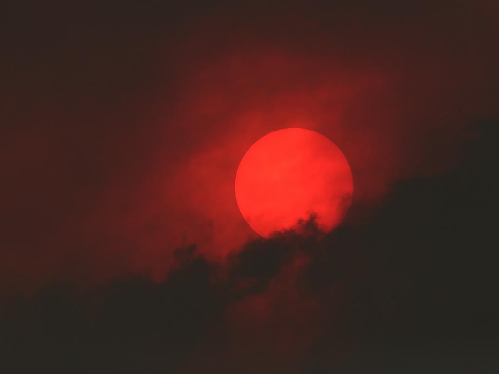 January 2019 Tasmanian Bushfires. The sun viewed from Castle Forbes Bay in the Huon Valley. Picture: NIKKI DAVIS-JONES