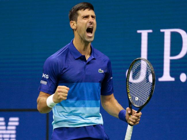 Serbia's Novak Djokovic celebrates during his 2021 US Open Tennis tournament men's semifinal match against Germany's Alexander Zverev at the USTA Billie Jean King National Tennis Center in New York, on September 10, 2021. (Photo by Kena Betancur / AFP)