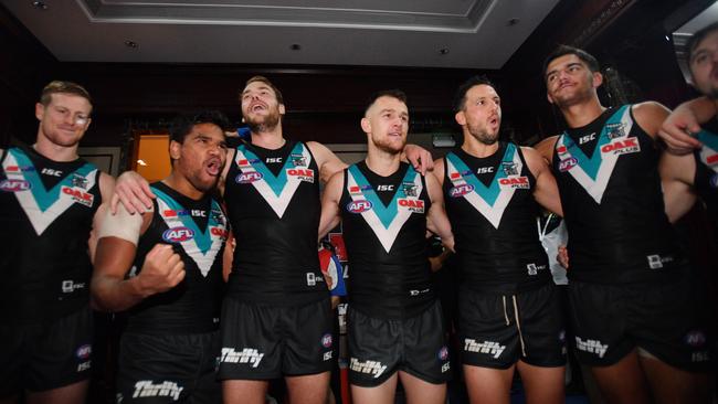 Power players celebrate in the change rooms after the win in Shanghai. Picture: AAP Image/David Mariuz