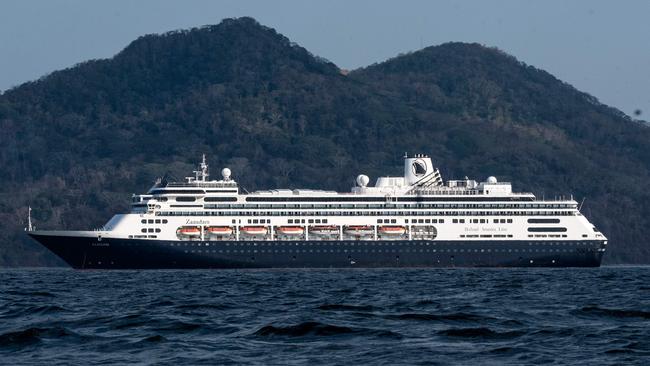 Holland America’s cruise ship Zaandam enters the Panama City bay to be assisted by the Rotterdam cruise ship with supplies, personnel and COVID-19 testing devices on Friday. Picture: AFP