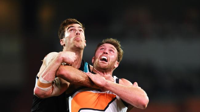 Scott Lycett rucks against Dawson Simpson of the Giants last week. Picture: Mark Brake/Getty Images