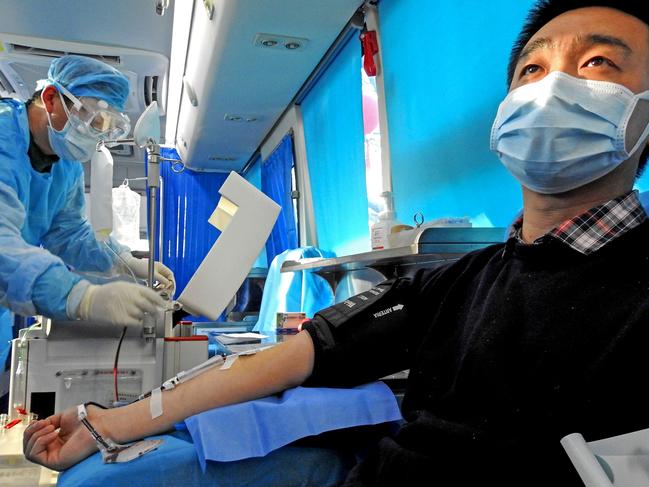 A man who has recovered from the COVID-19 coronavirus infection donating plasma in Lianyungang in China's eastern Jiangsu province. Picture: STR/AFP