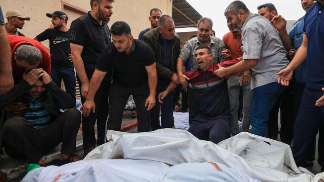 Palestinians mourn their relatives at a hospital after an Israeli air strike on the refugee camp of Jabalia in the Gaza Strip. Picture: Mahmud Hams/AFP