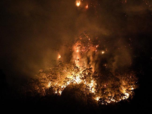 A bushfire burns out of control in the Blue Mountains on Monday. Picture: Saeed Khan/AFP