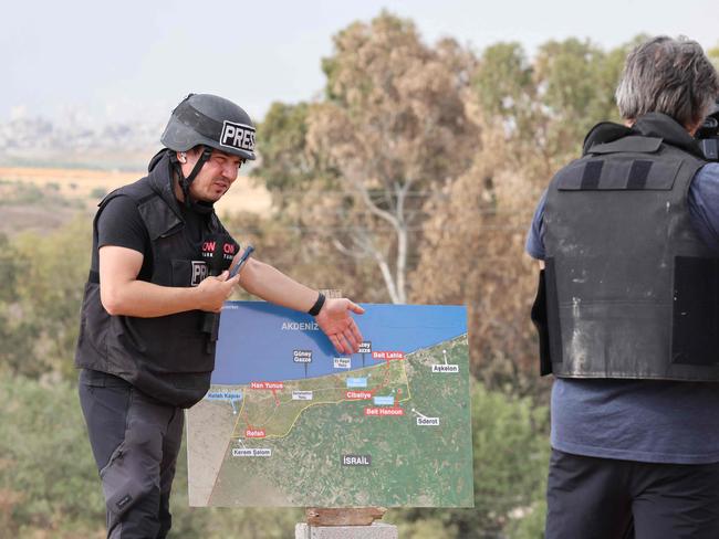 Journalists report from Sderot in southern Israel on November 13, 2023, amid ongoing battles between Israel and the Palestinian Hamas group. (Photo by Jack Guez / AFP)