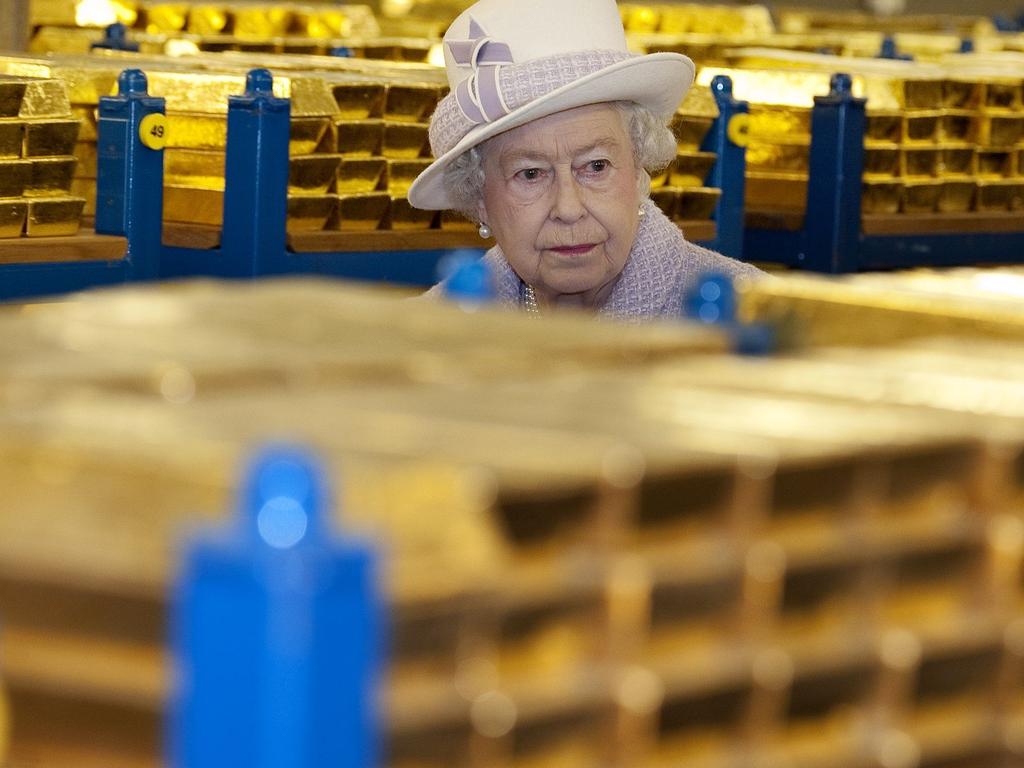 Queen Elizabeth inspects gold reserves in a vault at the Bank of England in London. Picture: AFP PHOTO/POOL/ Eddie Mulholland