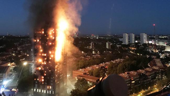 Spreading vertically via combustible cladding, fire engulfs London’s Grenfell Tower.