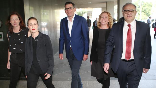 Premier Daniel Andrews with Adem Somyurek and other MPs during happier days.