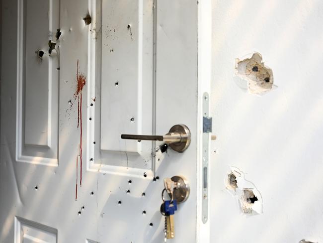 Gunshots and blood stains are seen on a door and walls of a house in Kfar Aza, Israel. Picture: Getty