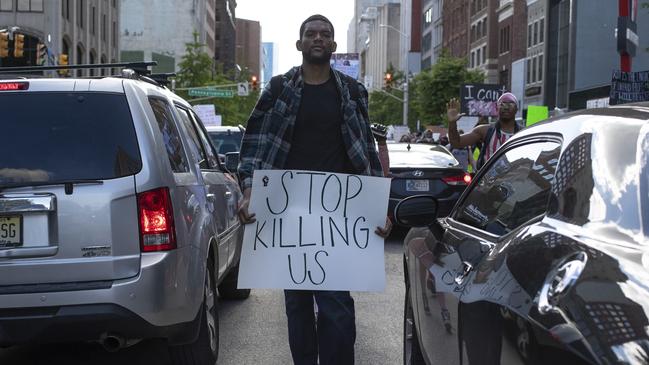 Protesters rally in downtown Indianapolis. Picture: Mykal McEldowney