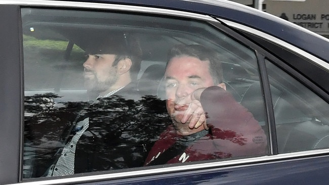 Suspended Logan City mayor Luke Smith is seen being driven from the Logan Police Headquarters in Logan City, Friday, July 20, 2018. Smith was arrested after a disturbance at Meadowbrook on Friday morning. (AAP Image/Darren England) NO ARCHIVING