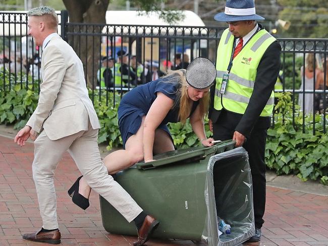 Under the gaze of a security guard, girl dismounts from her pretend horse. Picture: Getty.