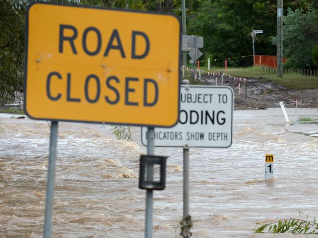 Flood water inundate a road in Dalby, Queensland, Monday, March 4, 2013. About 290 properties were affected by flooding in the Darling Downs community at the weekend after the Myall Creek peaked at 3.21 metres early on Sunday morning, breaking its banks at North Dalby. (AAP Image/Dan Peled) NO ARCHIVING